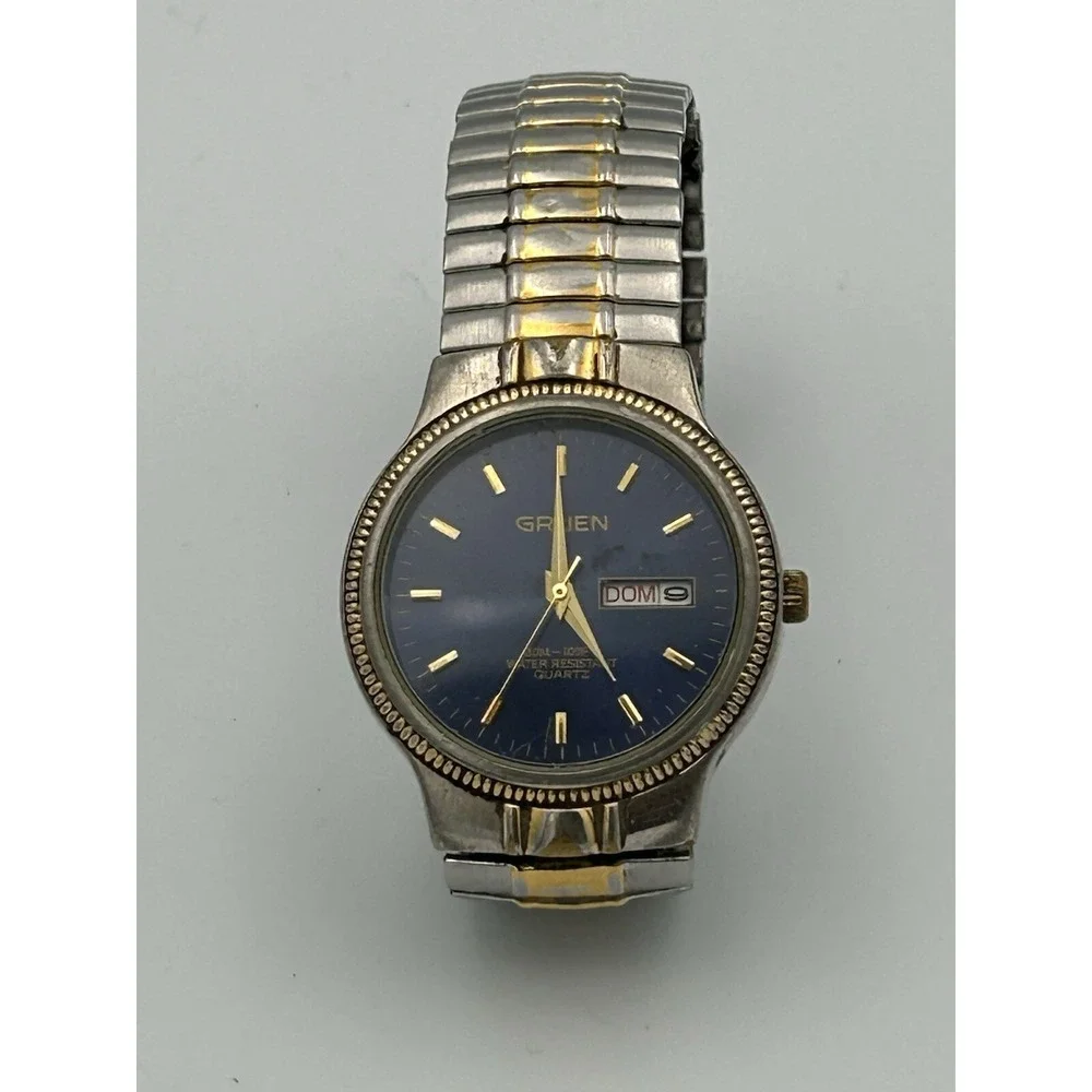 Gruen men's watch GU1022 Blue Face Stainless Steel And Gold Stretch Band Read